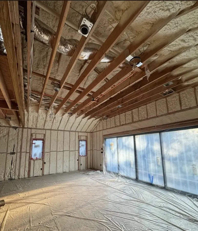 Interior walls and ceiling insulated with spray foam during new construction in Kosciusko